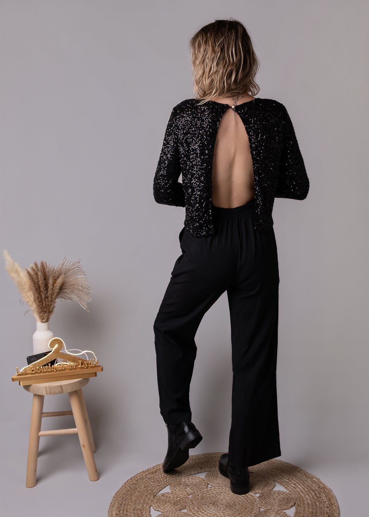 Combinaison pantalon palazzo noire haut sequins et dos nu