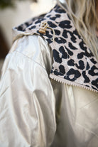 Parka léopard imperméable mi longue réversible or