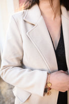 Manteau beige mi long, 4 boutons, avec poches