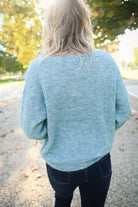Pull vert col V femme