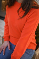 Pull orange, col rond, matière douce la boutique de lydie