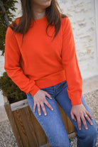 Pull orange, col rond, matière douce la boutique de lydie