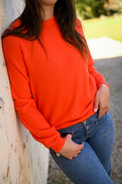 Pull orange, col rond, matière douce la boutique de lydie