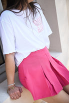 Jupe short fuchsia, plissé sur le devant la boutique de lydie