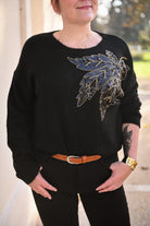 Pull noir feuille sequins la boutique de lydie