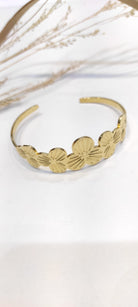 Bracelet en jonc rigide acier inoxydable or motif fleurs