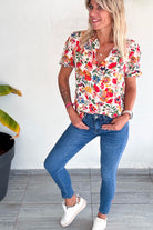 jean slim  7 ⁄ 8 fendu avec broderie coeur rouge