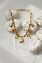 Collier charms soleil en acier inoxydable doré