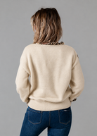 Pull col V beige détails léopard 