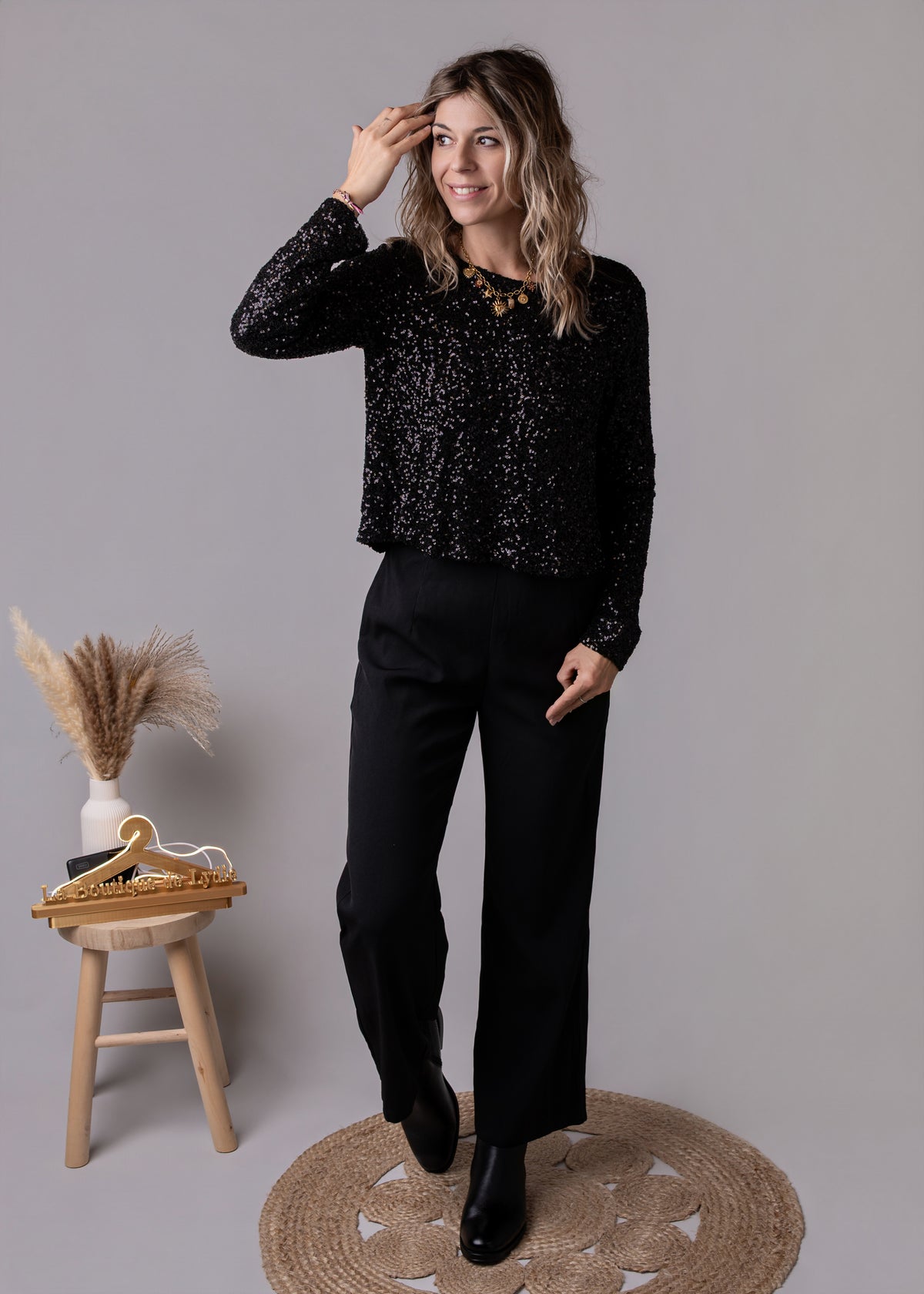 Combinaison pantalon palazzo noire haut sequins et dos nu 