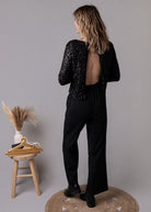 Combinaison pantalon palazzo noire haut sequins et dos nu 