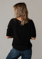 Pull fin col V noir brodé léopard Iconic