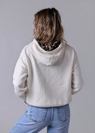 Sweat pull à capuche beige détails léopard